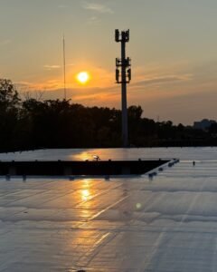 Polyurea roof coating installation on commercial roof