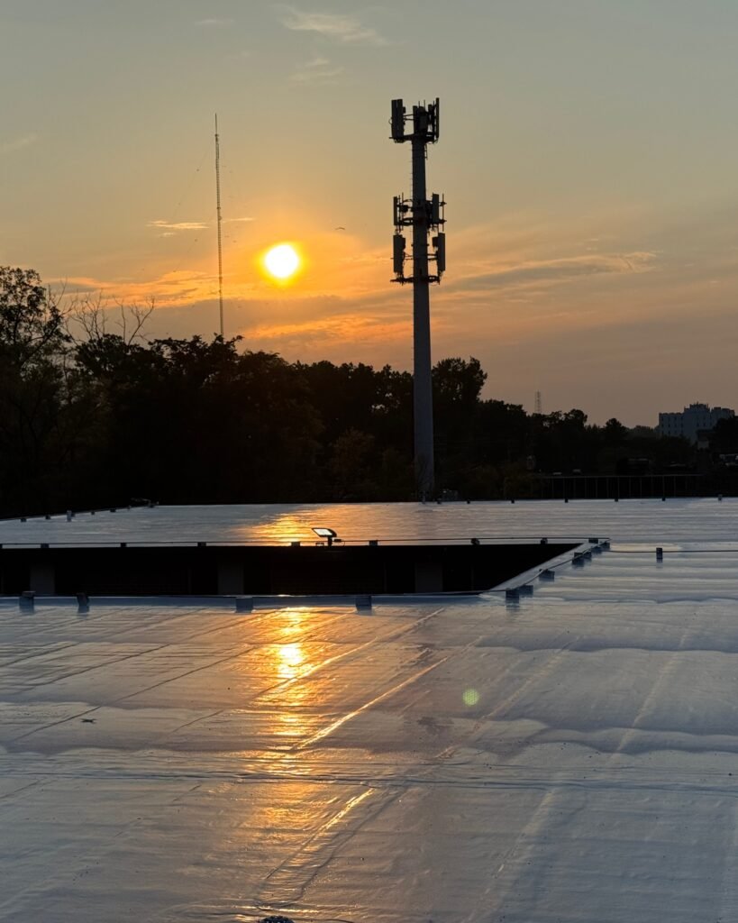 Polyurea roof coating installation on commercial roof