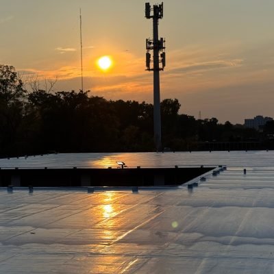 Polyurea roof coating installation on commercial roof